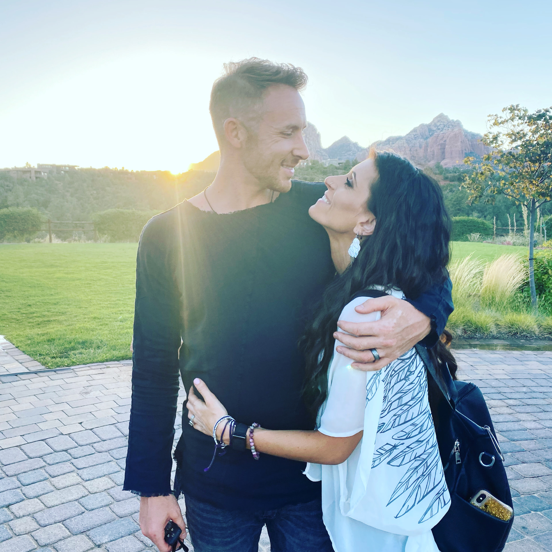 Victor and Pattie embracing at sunset in Sedona